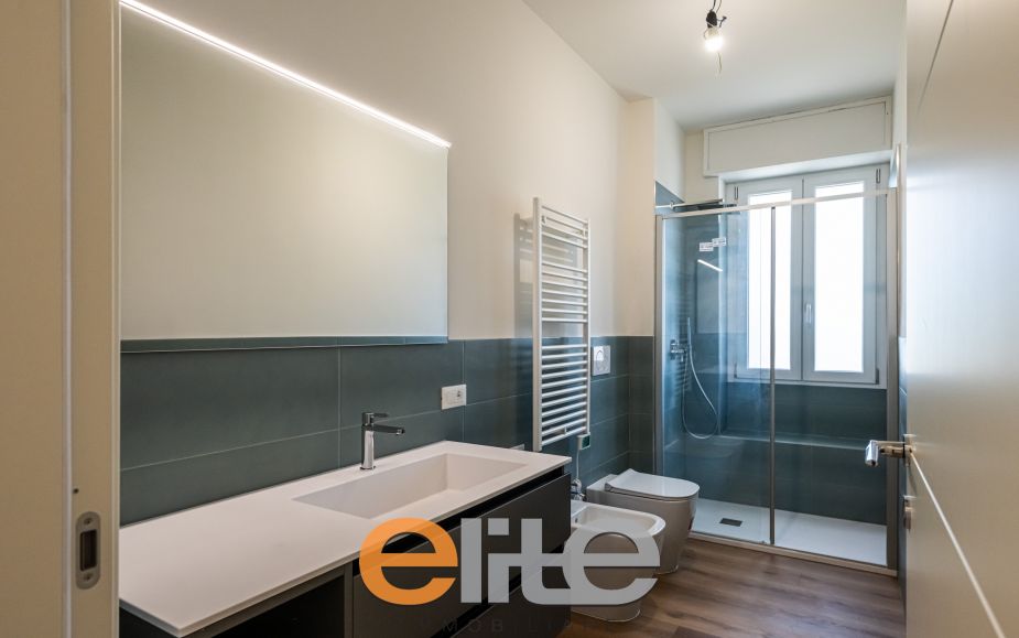 The apartment opens onto a living room with a brand-new, never-used open-plan kitchen