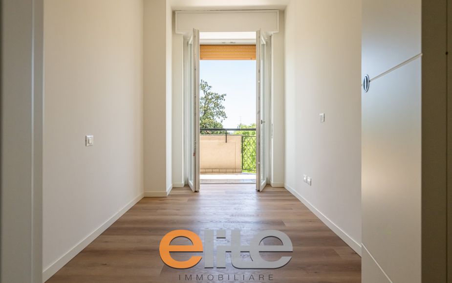 The apartment opens onto a living room with a brand-new, never-used open-plan kitchen